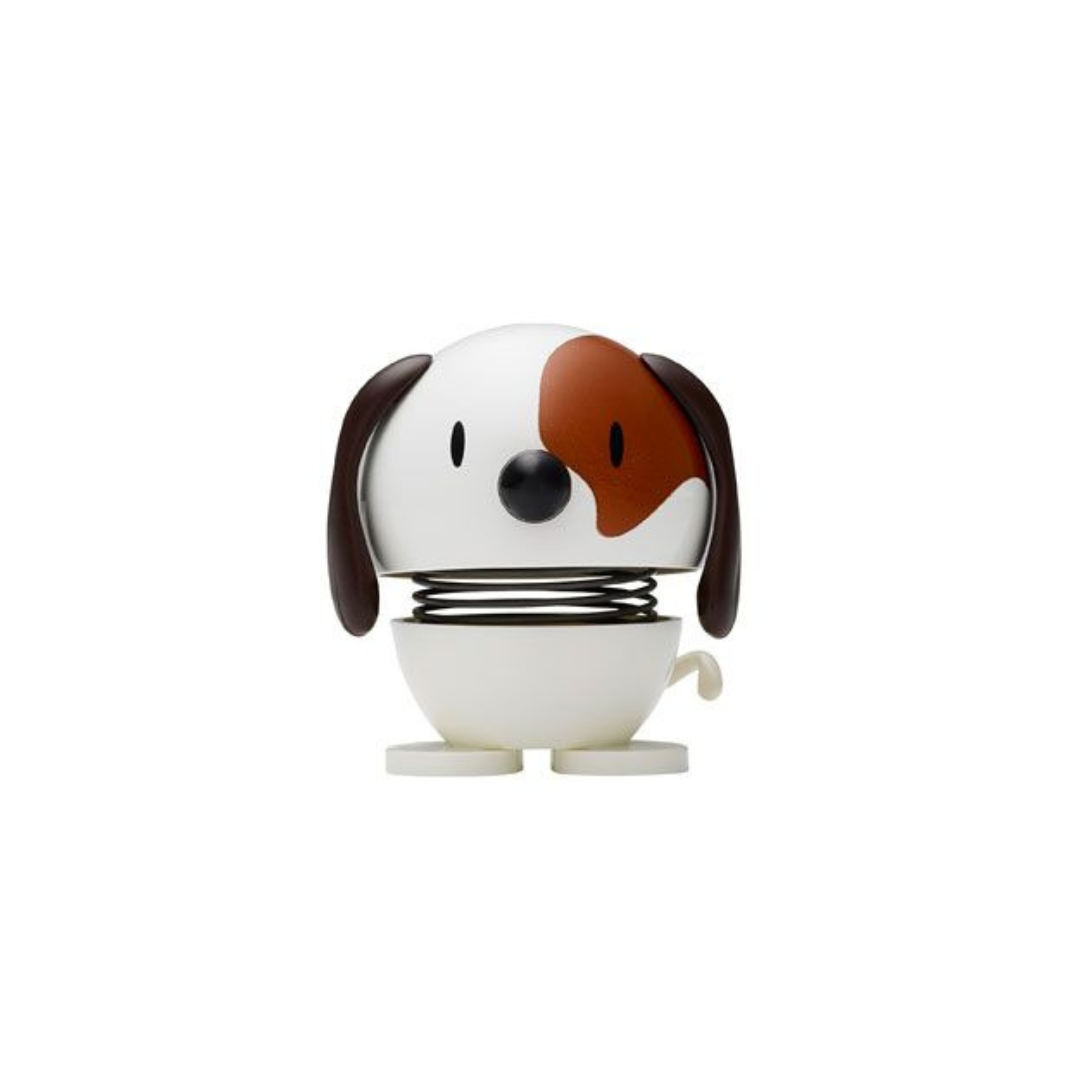 White and brown bobblehead dog toy on a spring.