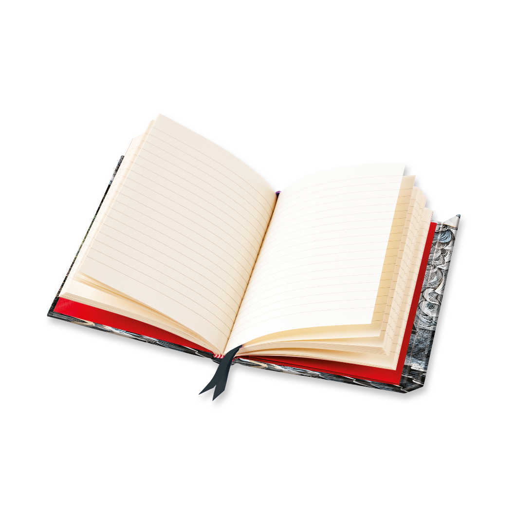 Open lined notebook with red and patterned cover, black ribbon bookmark.