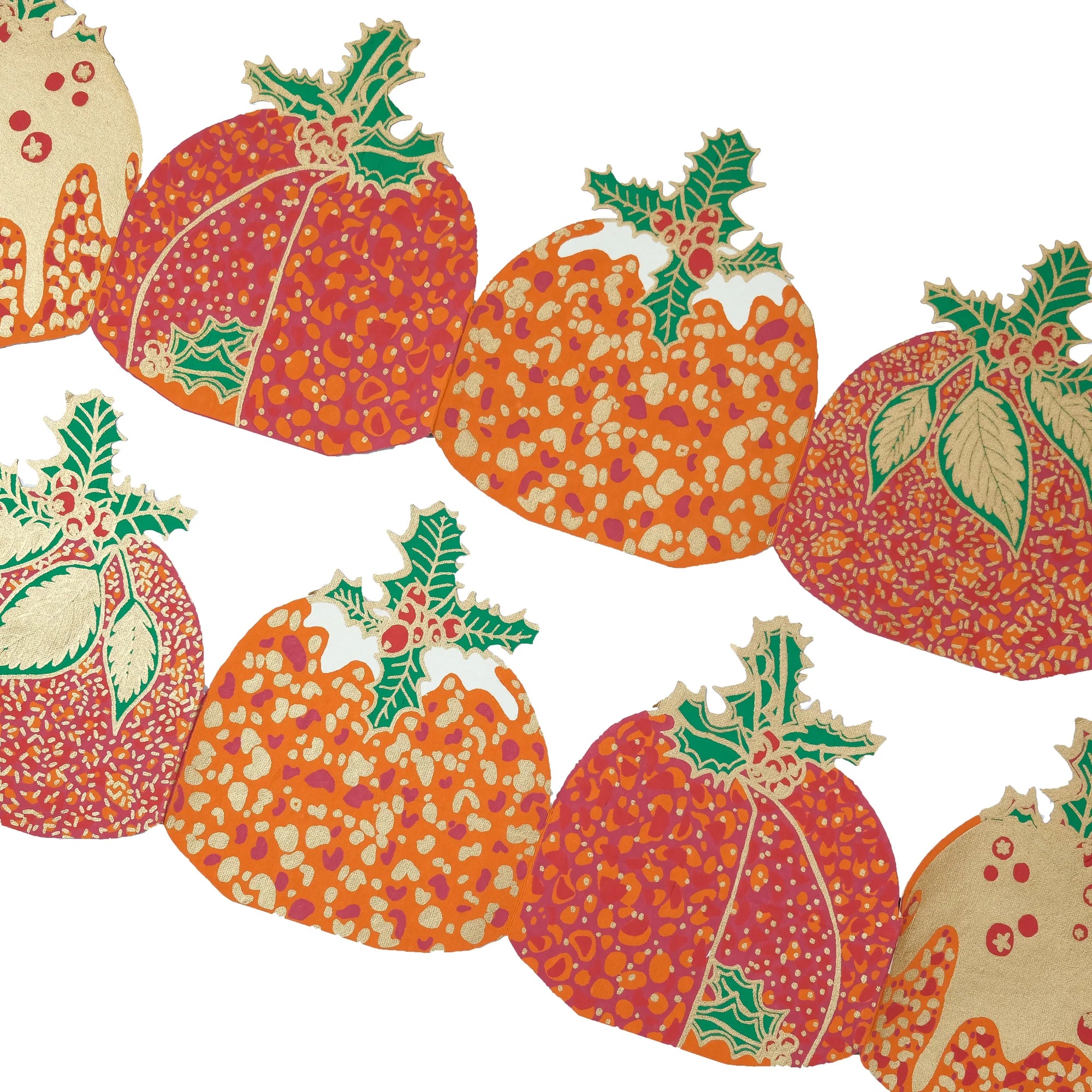 Patterned pumpkins with green leaves on a white background