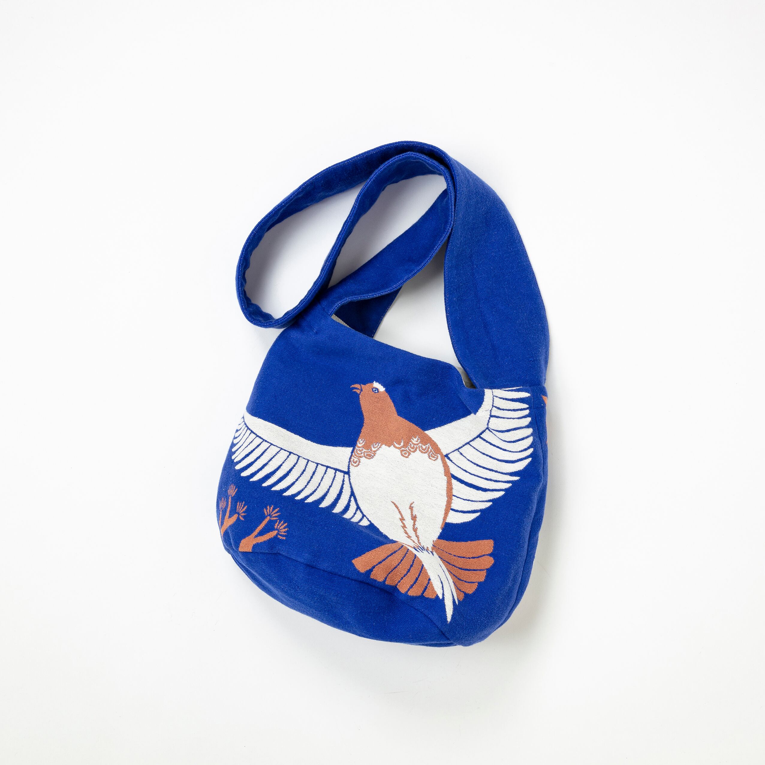 Blue bag with a bird design on a white background