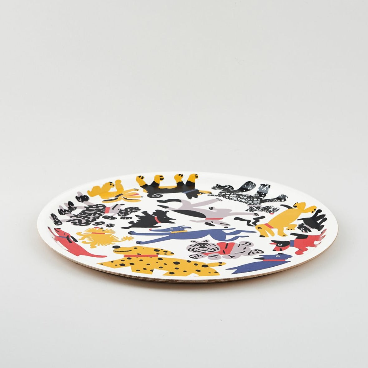 Round platter featuring a colorful illustration of various stylized dogs in playful poses.