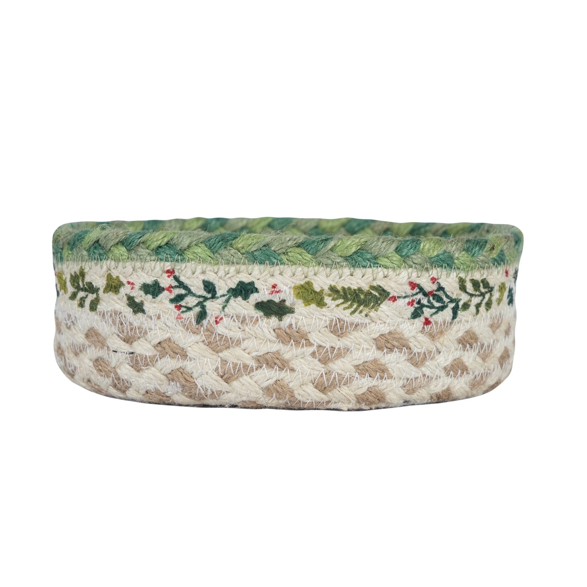 Round jute basket with green braided trim and embroidered holly design.