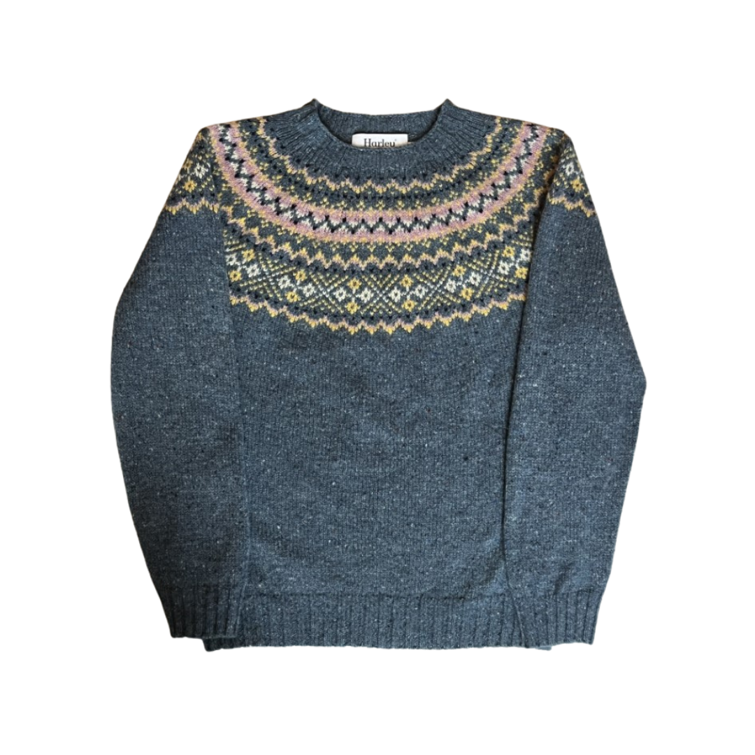 Blue knitted sweater with a patterned neckline on a white background
