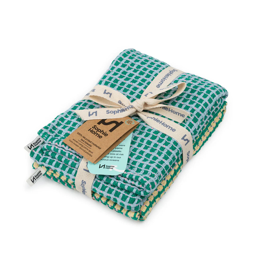 Folded green and white checkered blanket with a Sophie Home tag on a white background