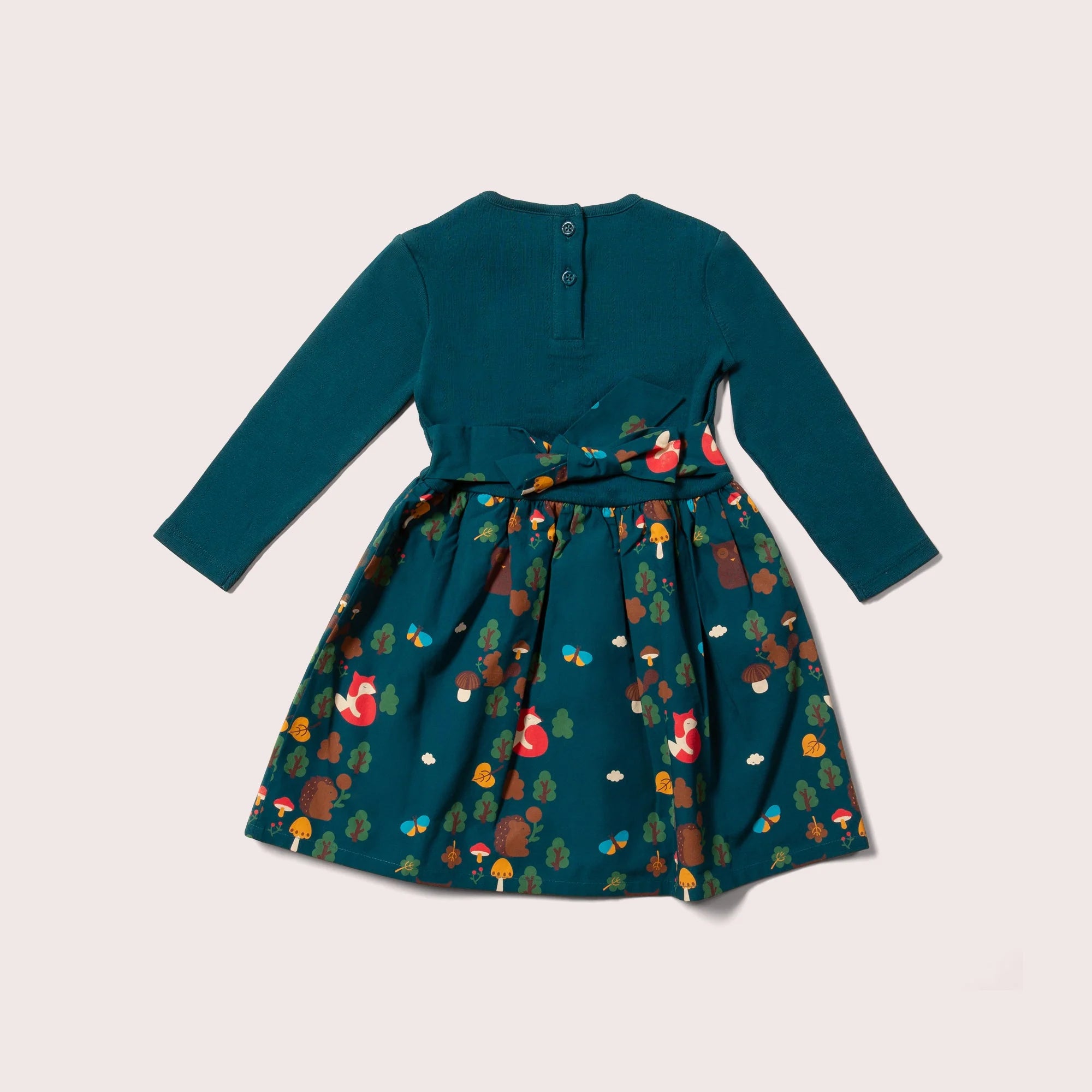 Teal long-sleeved girl's dress with a forest animal print.  The skirt features foxes, hedgehogs, mushrooms, and trees.
