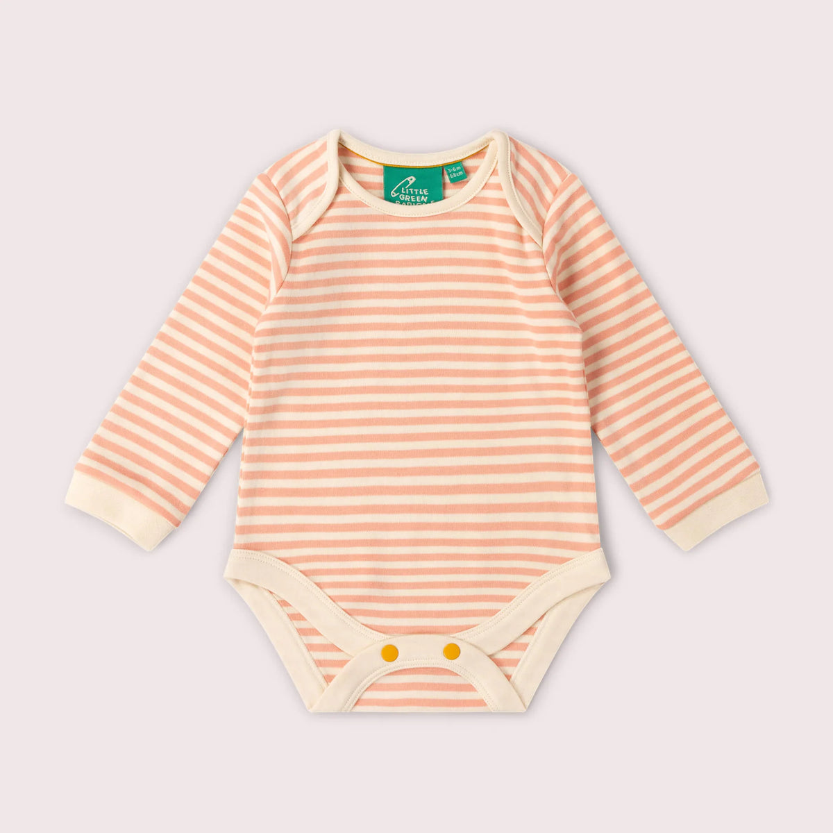 A long-sleeve baby bodysuit with horizontal peach and cream stripes, featuring a green 'Bouclier' brand label at the collar and snap closures at the crotch, laid flat on a light pink background.