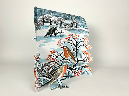 Decorative pillow with winter scene design featuring birds and trees on a light gray background