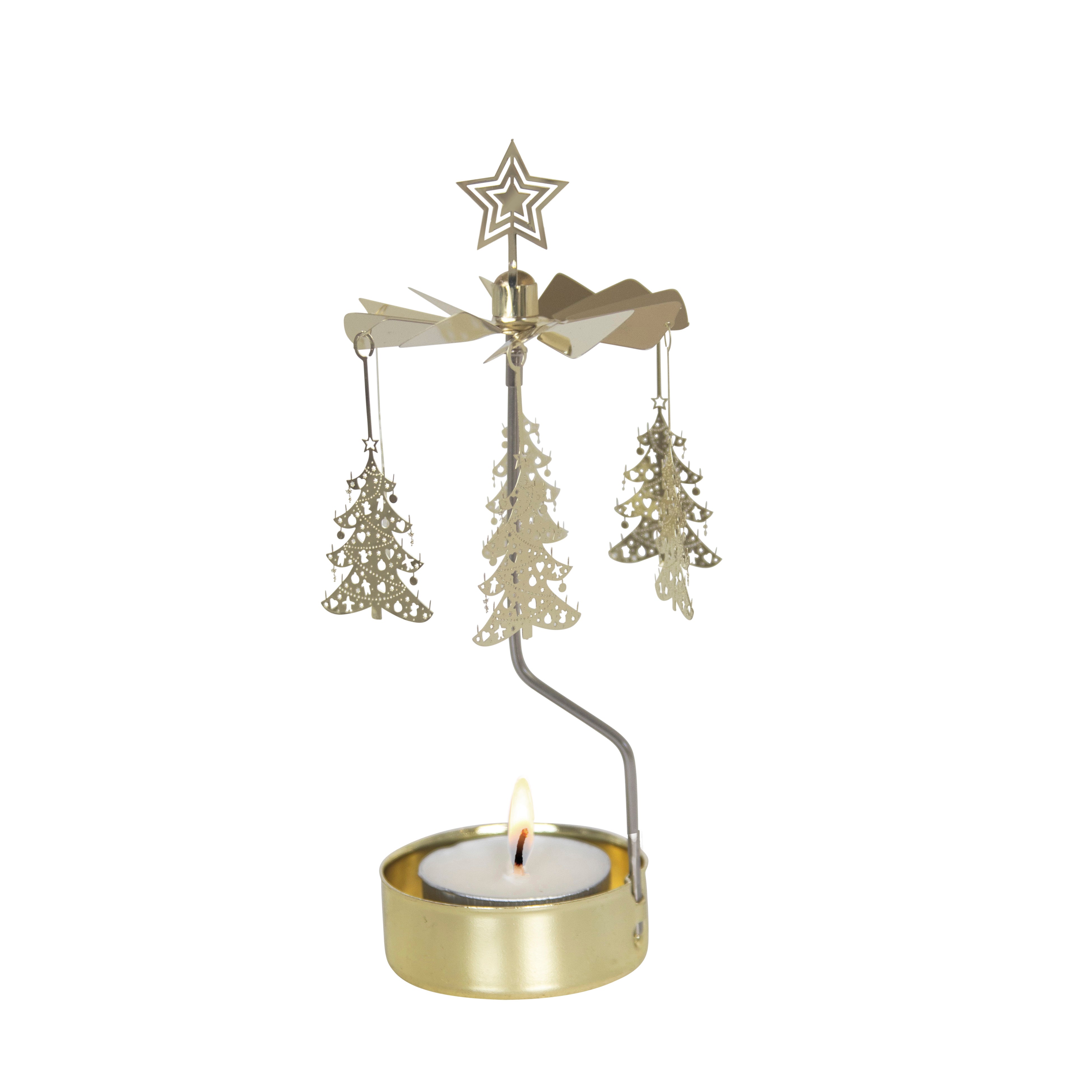 Gold metal Christmas candleholder with a star top and three rotating Christmas tree ornaments.