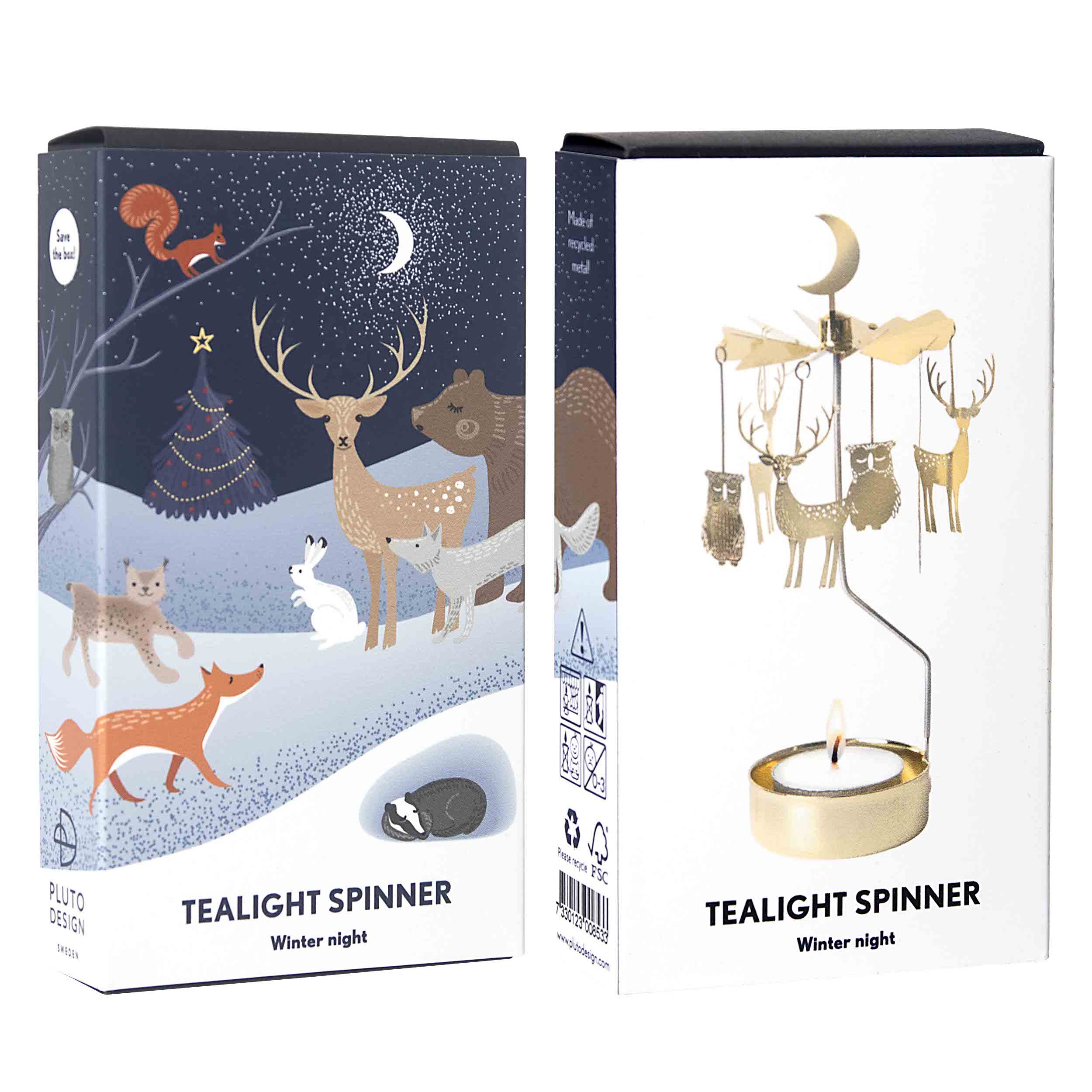 Two product boxes for a 'Tealight Spinner' winter night scene, shown side-by-side against a white background. The left box features a dark blue, snowy forest illustration with deer, fox, and a squirrel.