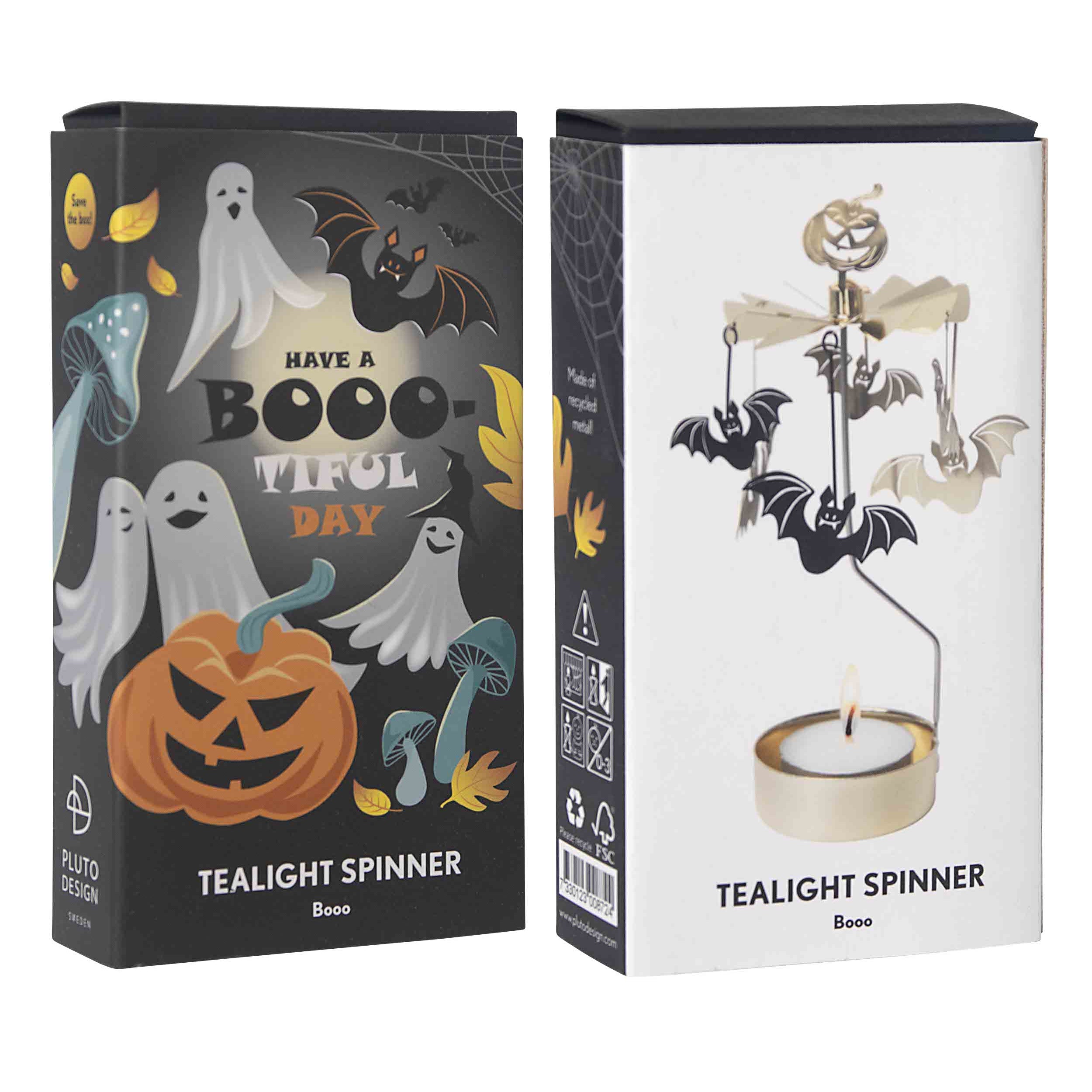 Two retail boxes for a Halloween-themed tealight spinner set on a plain white background. The left box is dark gray with spooky illustrations including ghosts, bats, a pumpkin, and the text 'HAVE A BOO-TOO DRY TEALIGHT SPINNER'; the right box is white with a pictured spinning top design and the same product name.