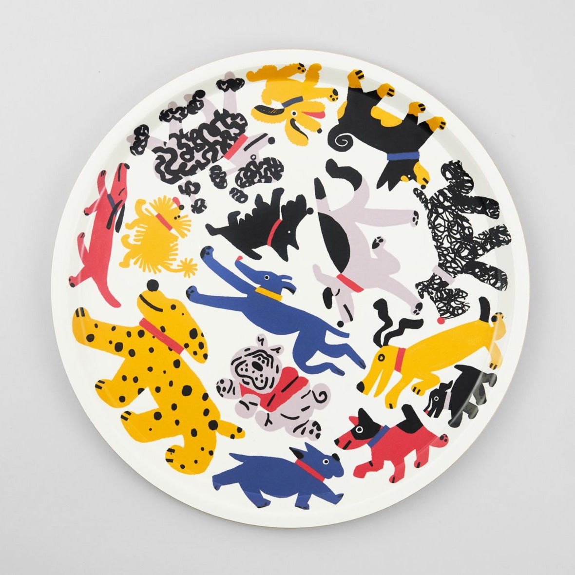 Round tray featuring a colorful illustration of various dog breeds in playful poses.