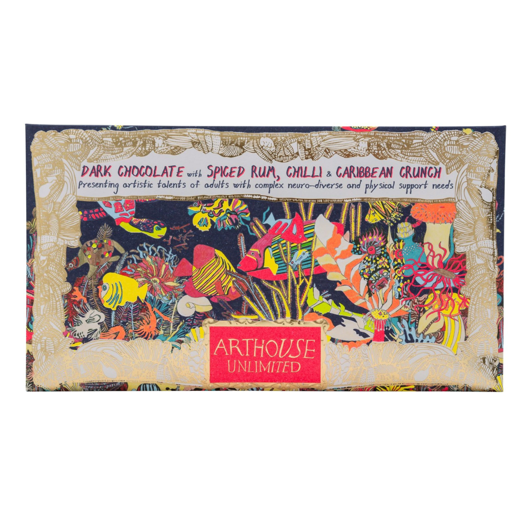 Dark chocolate bar wrapper featuring vibrant artwork of tropical fish and coral, with "Arthous Unlimited" logo.