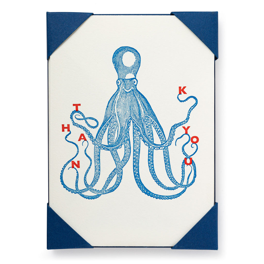 Blue illustrated octopus on a cream-colored thank you card with navy blue corners.