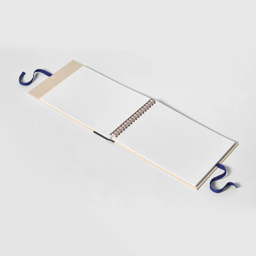 Open notebook with a blue hook on a white background