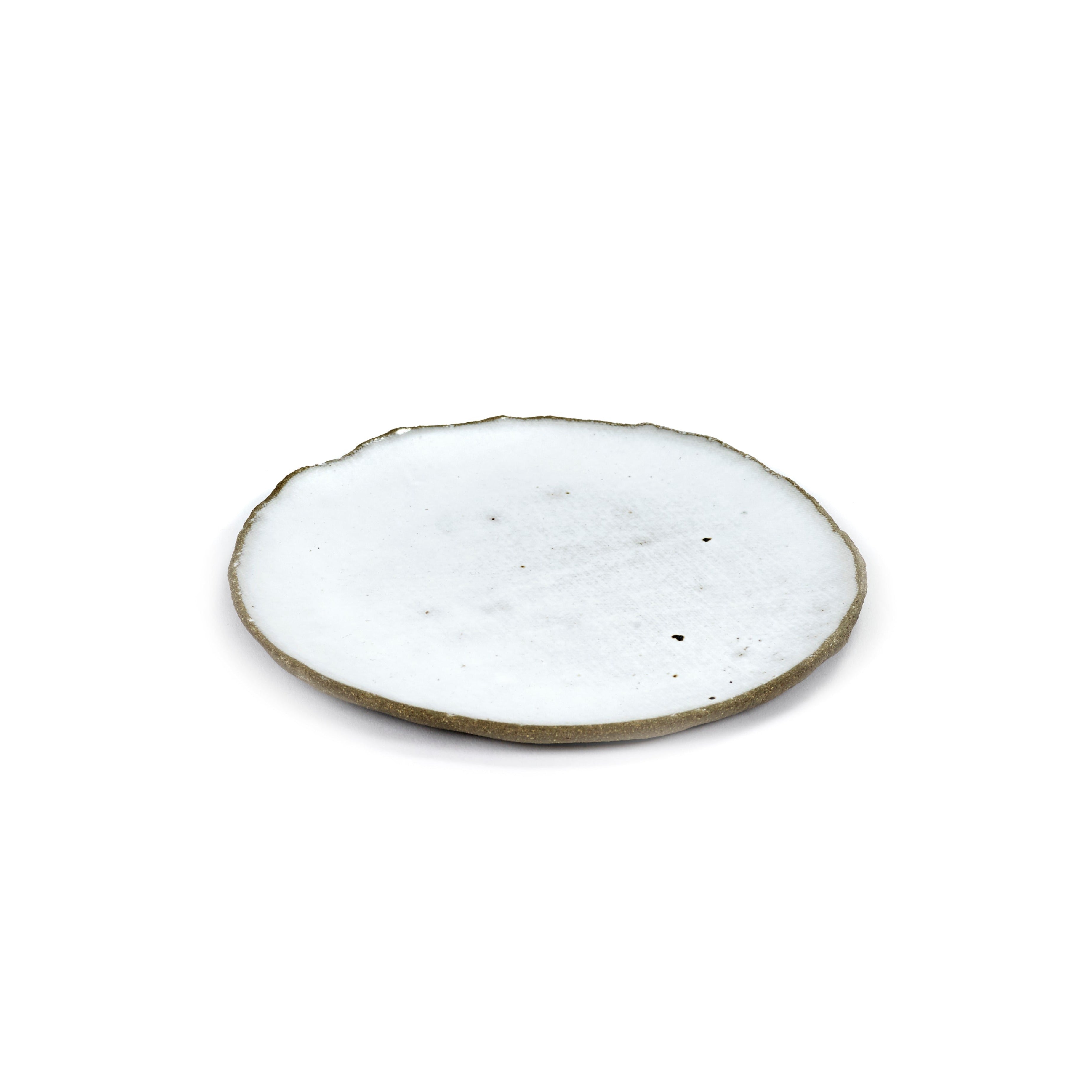 White ceramic plate with an irregular, slightly rough edge and a speckled, off-white surface.
