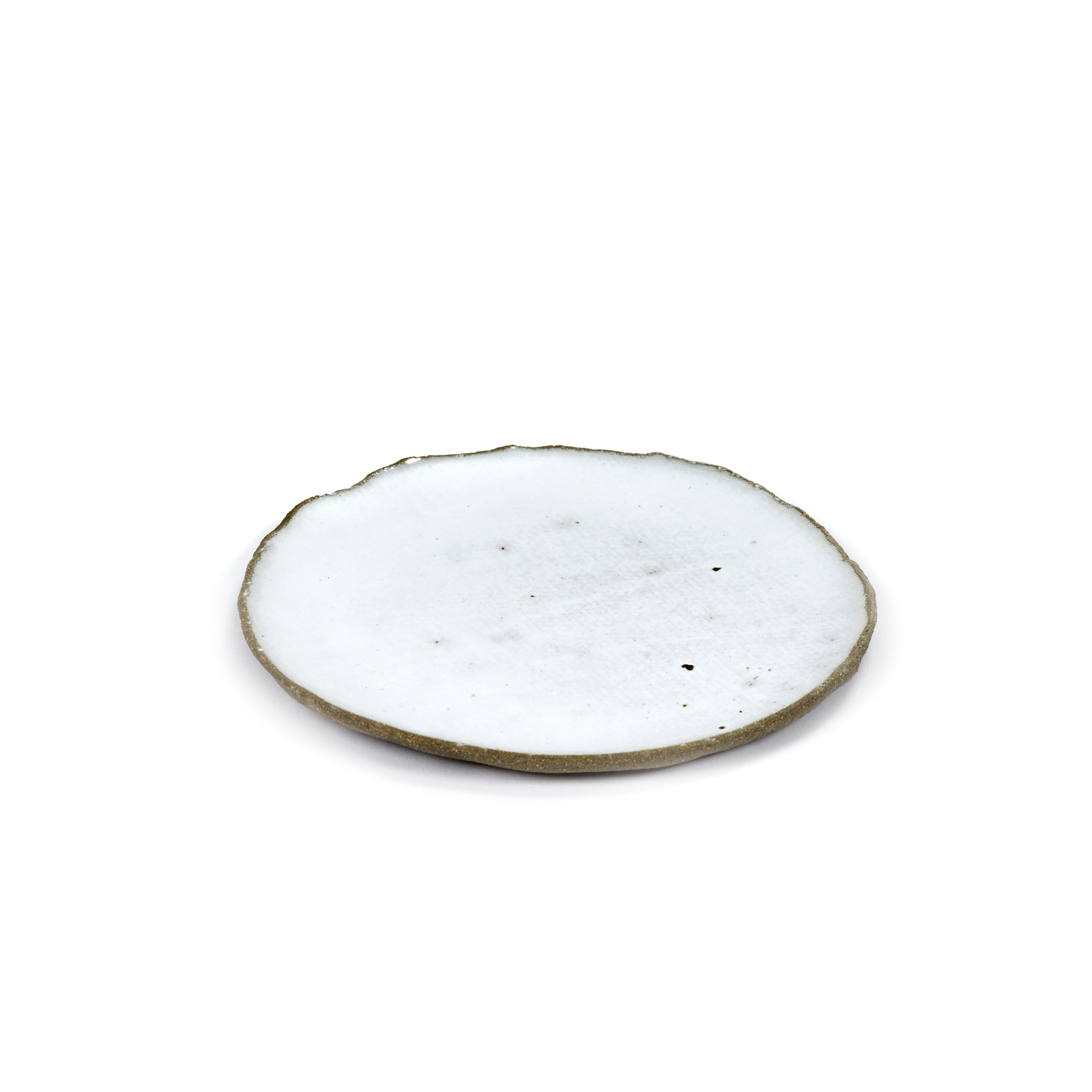 White ceramic plate with an irregular, slightly textured edge and a speckled, off-white surface.