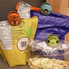 Three playful animal-shaped bag clips securing various snack bags.  Clips feature walrus, sea turtle, and puffin designs.