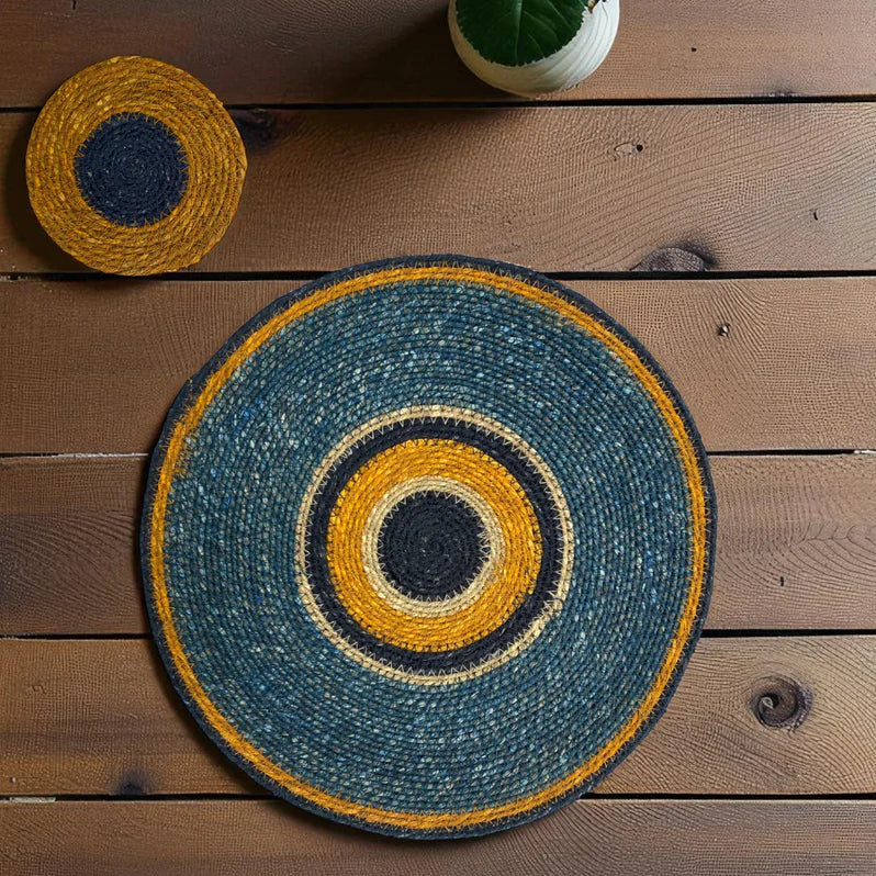 Round woven mat with concentric circles on a wooden surface