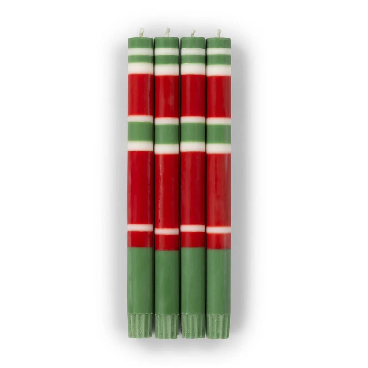 Set of four striped candles in red, green, and white on a white background
