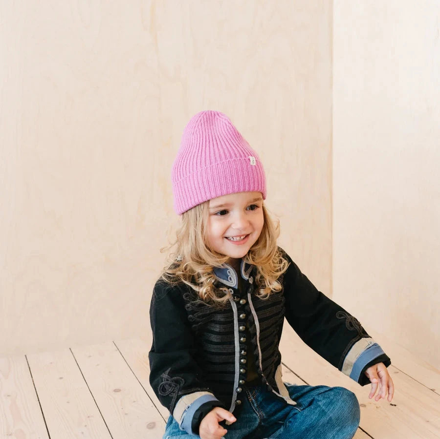 Pink ribbed knit beanie.
