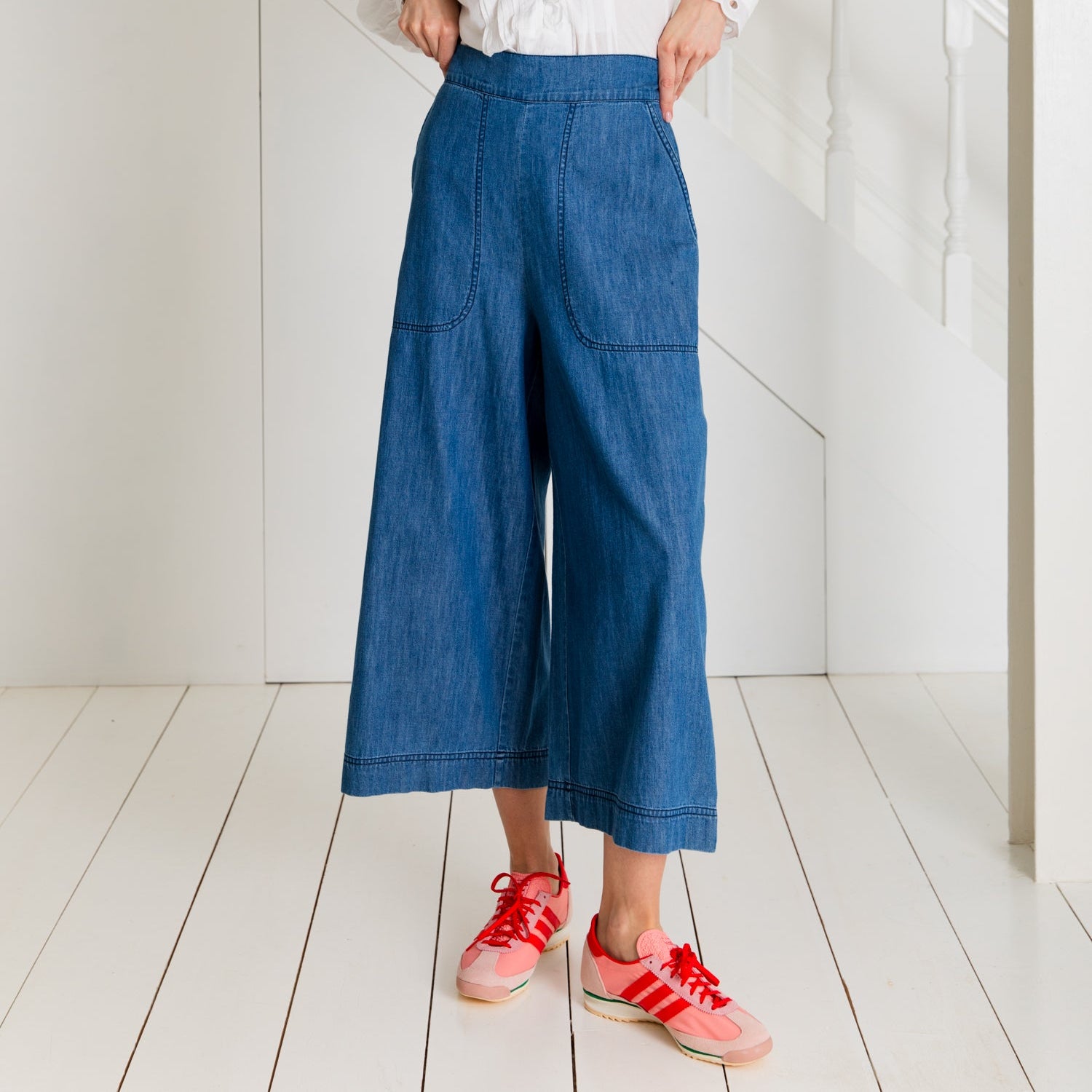 Wide-leg denim culottes with patch pockets.