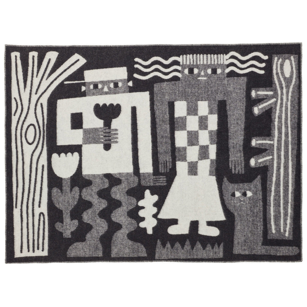 Black and white patterned rug by Donna Wilson, featuring stylized figures and flora designs.