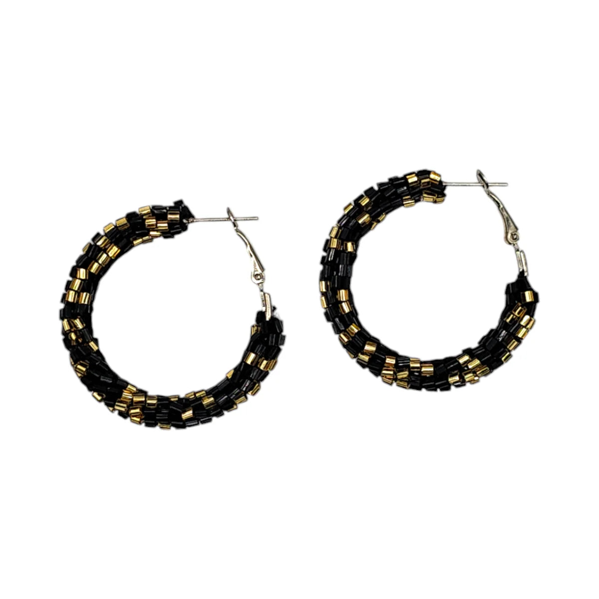 Pair of hoop earrings with black and gold beads on a white background