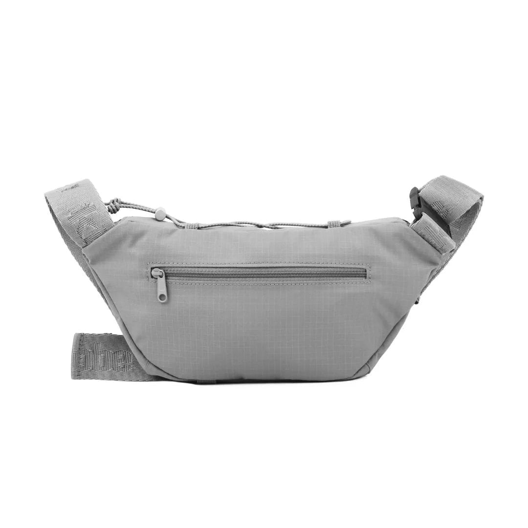 Grey fabric fanny pack with adjustable strap and zippered main compartment.