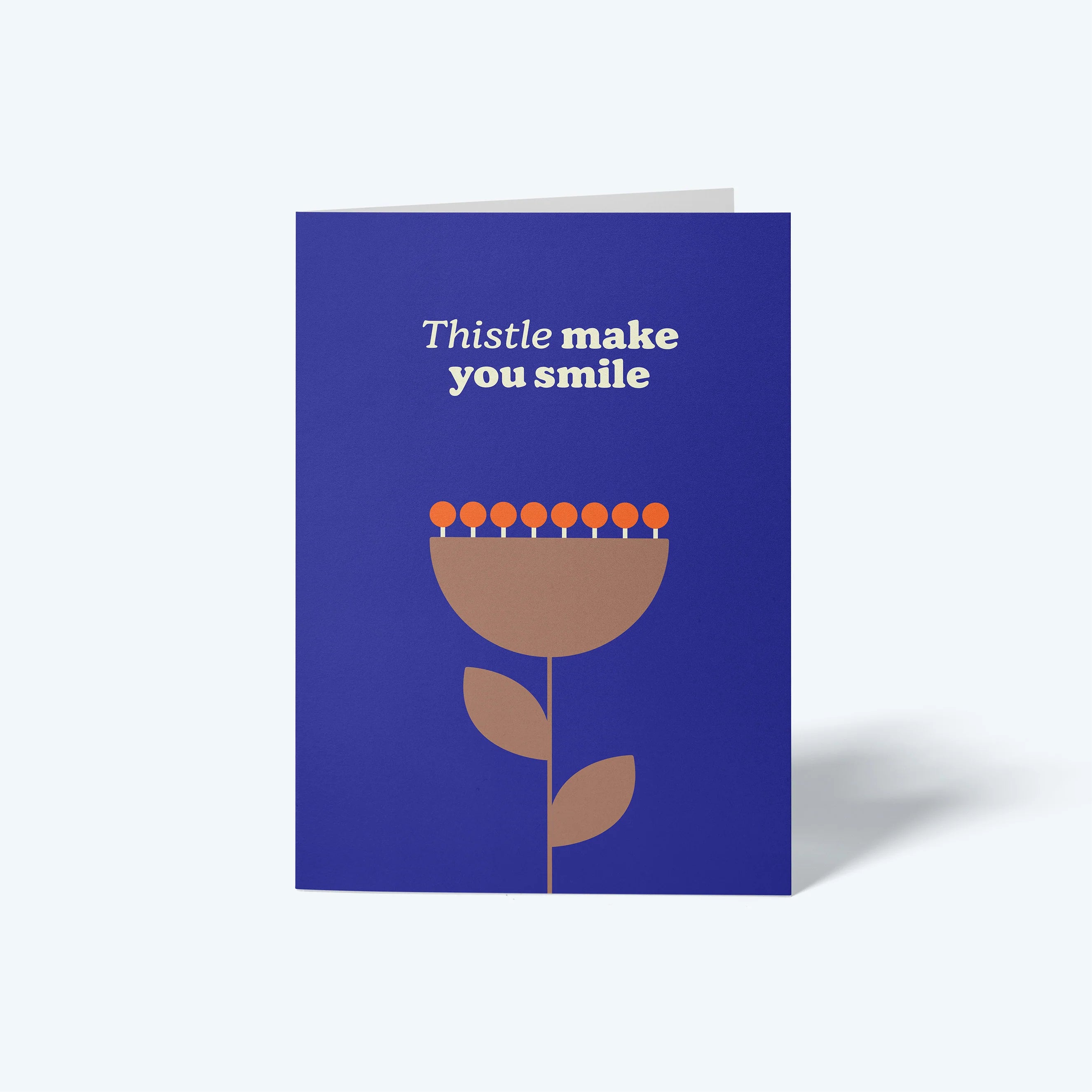 Greeting card with floral design and text on a blue background