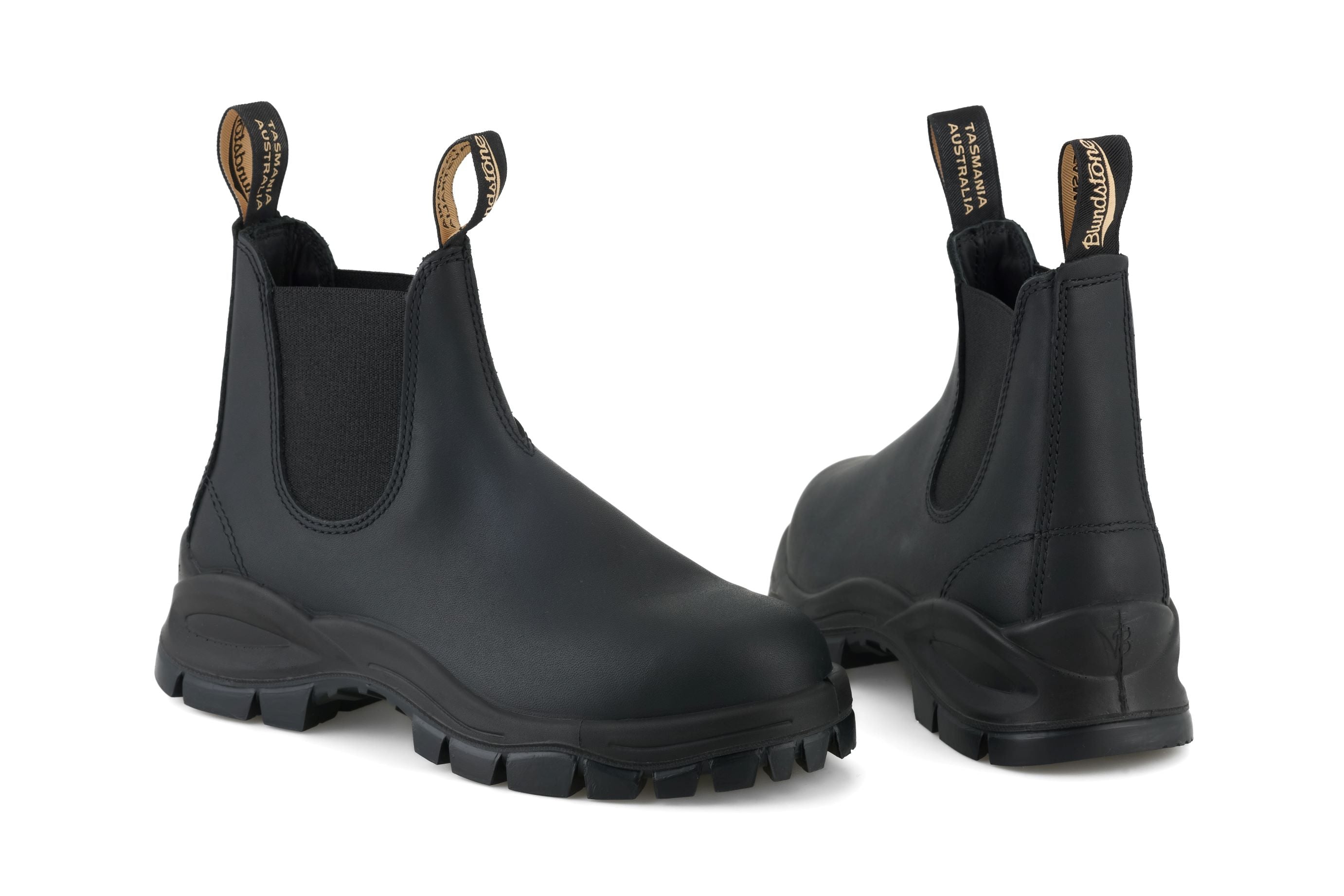 Pair of black Blundstone Chelsea boots with a rugged outsole.