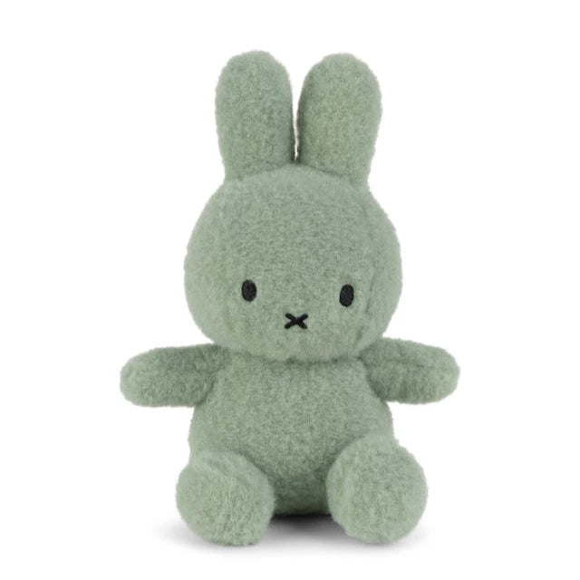 Sage green plush bunny rabbit toy with simple black facial features.