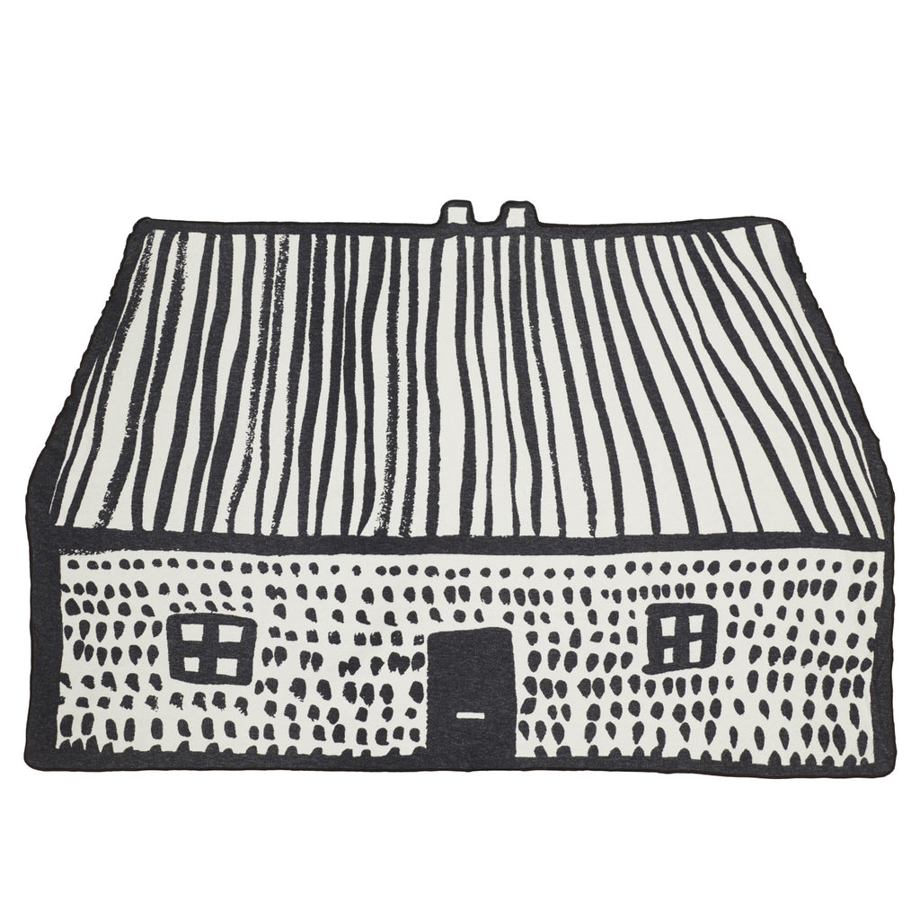 Black and white house-shaped design by Donna Wilson, featuring striped roof and dotted walls.