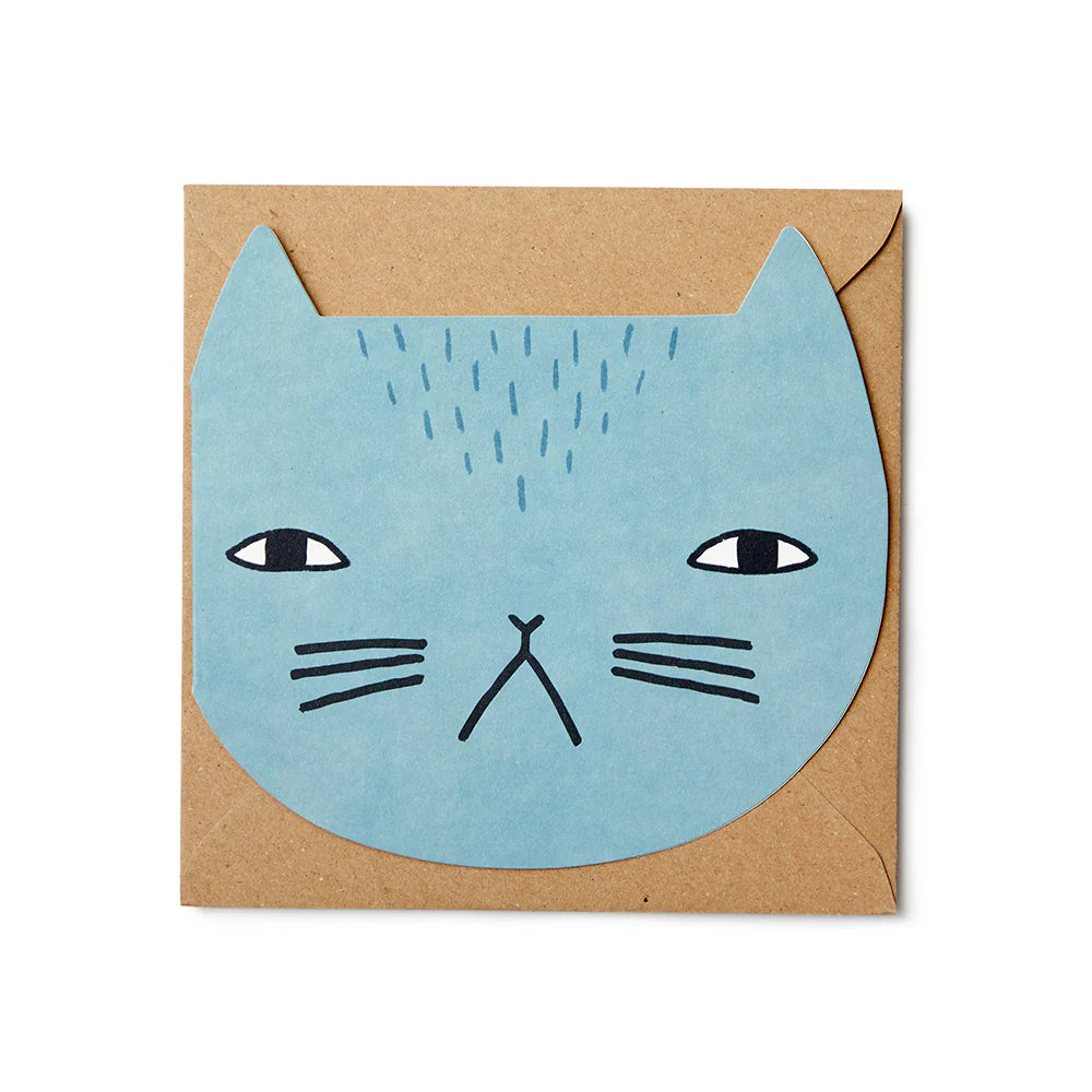 Light blue cat illustration on a kraft envelope, designed by Donna Wilson. Simple, playful design.