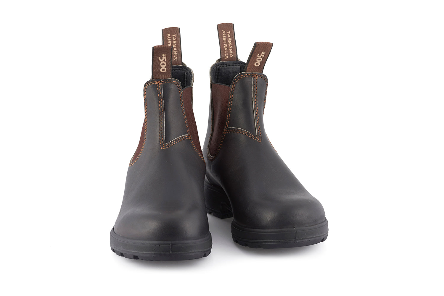 Pair of dark brown leather Blundstone #500 Chelsea boots with orange stitching detail and a rubber sole.
