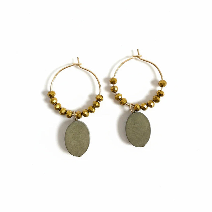 Gold hoop earrings with beaded accents and olive green oval stones on a white background
