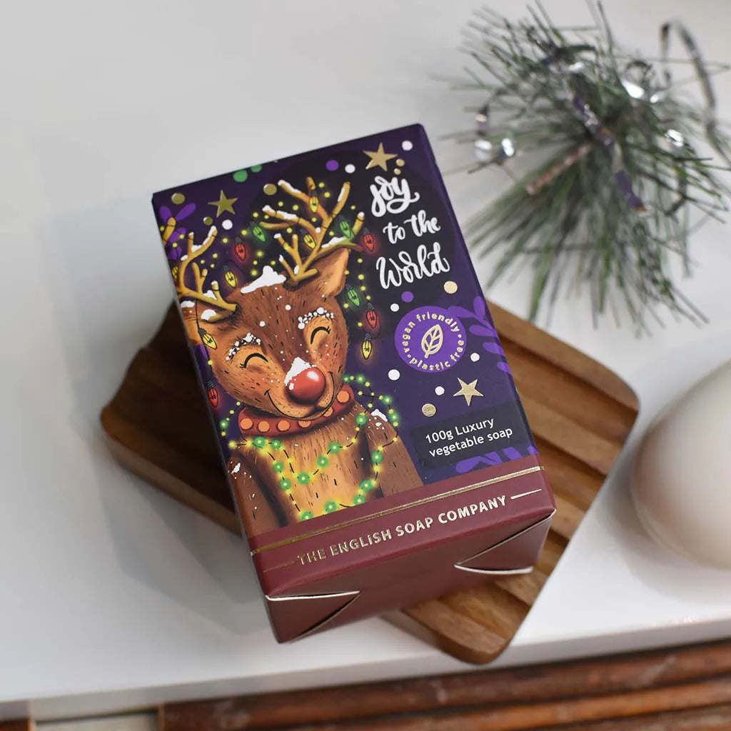 100g The English Soap Company luxury vegetable soap bar; purple box features a festive reindeer illustration and "Joy to the