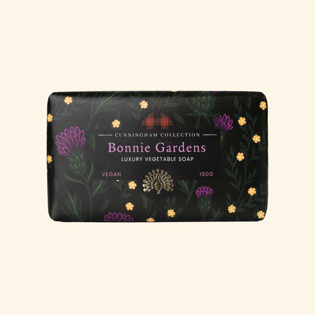 Black bar of Bonnie Gardens Luxury Vegetable Soap, 190g, featuring a floral design and gold detailing. Vegan.
