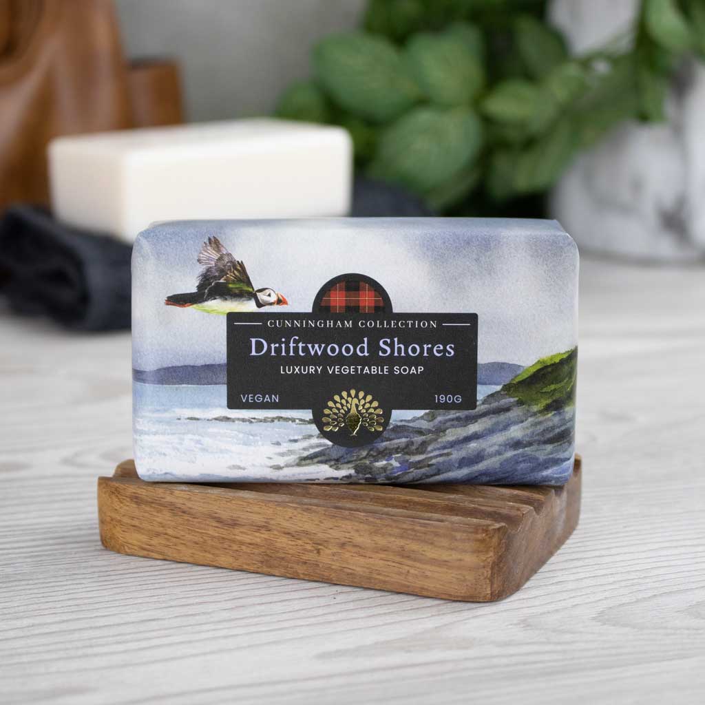 Driftwood Shores luxury vegan vegetable soap (190g), featuring a watercolor-style puffin and coastal scene on the packaging.