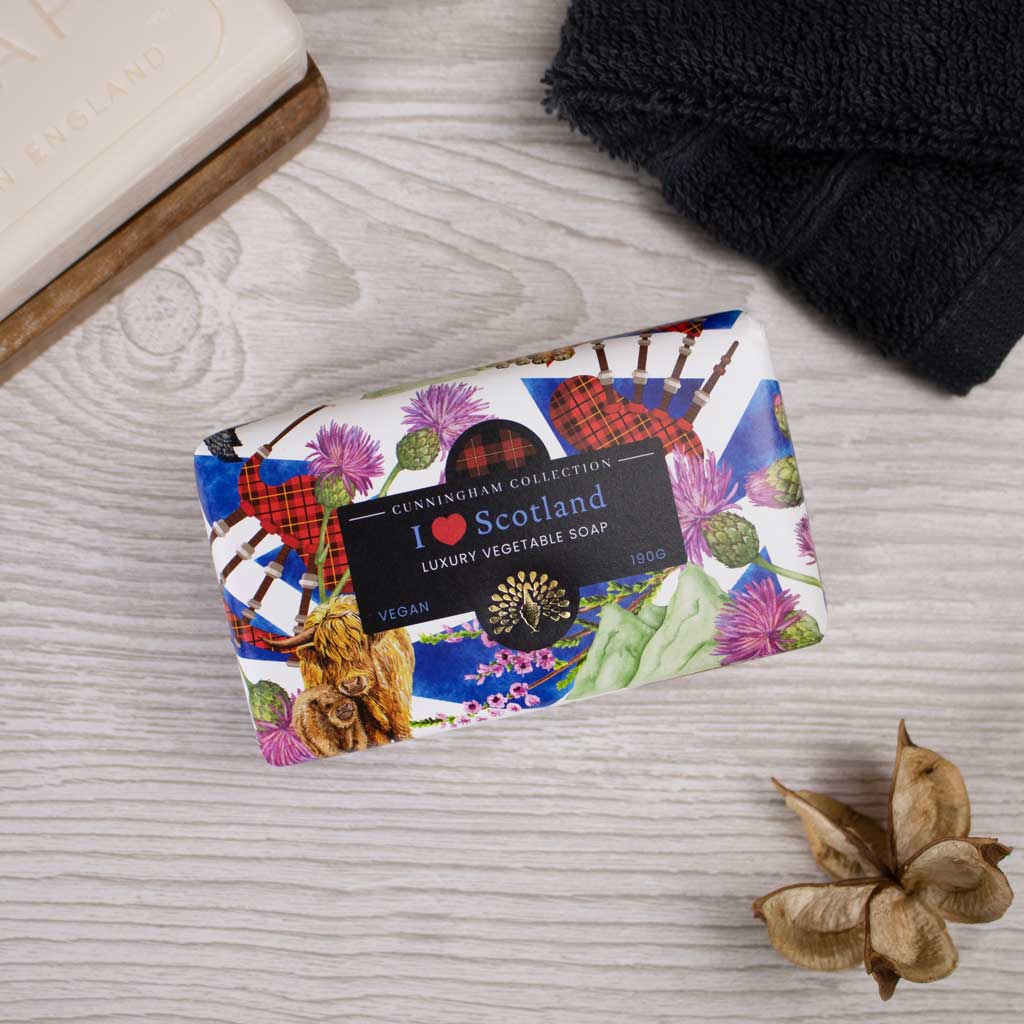 190g vegan luxury vegetable soap bar featuring a Scottish Highlands design; bagpipes, tartan, thistle, and Highland cow.