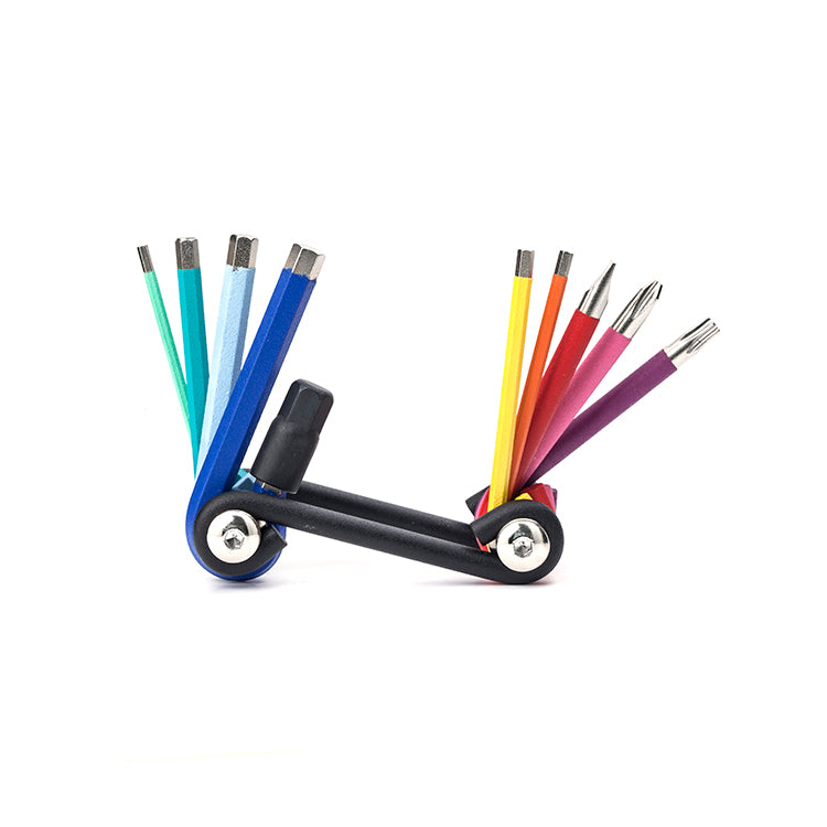 A close up of a multi coloured multi tool against a white background
