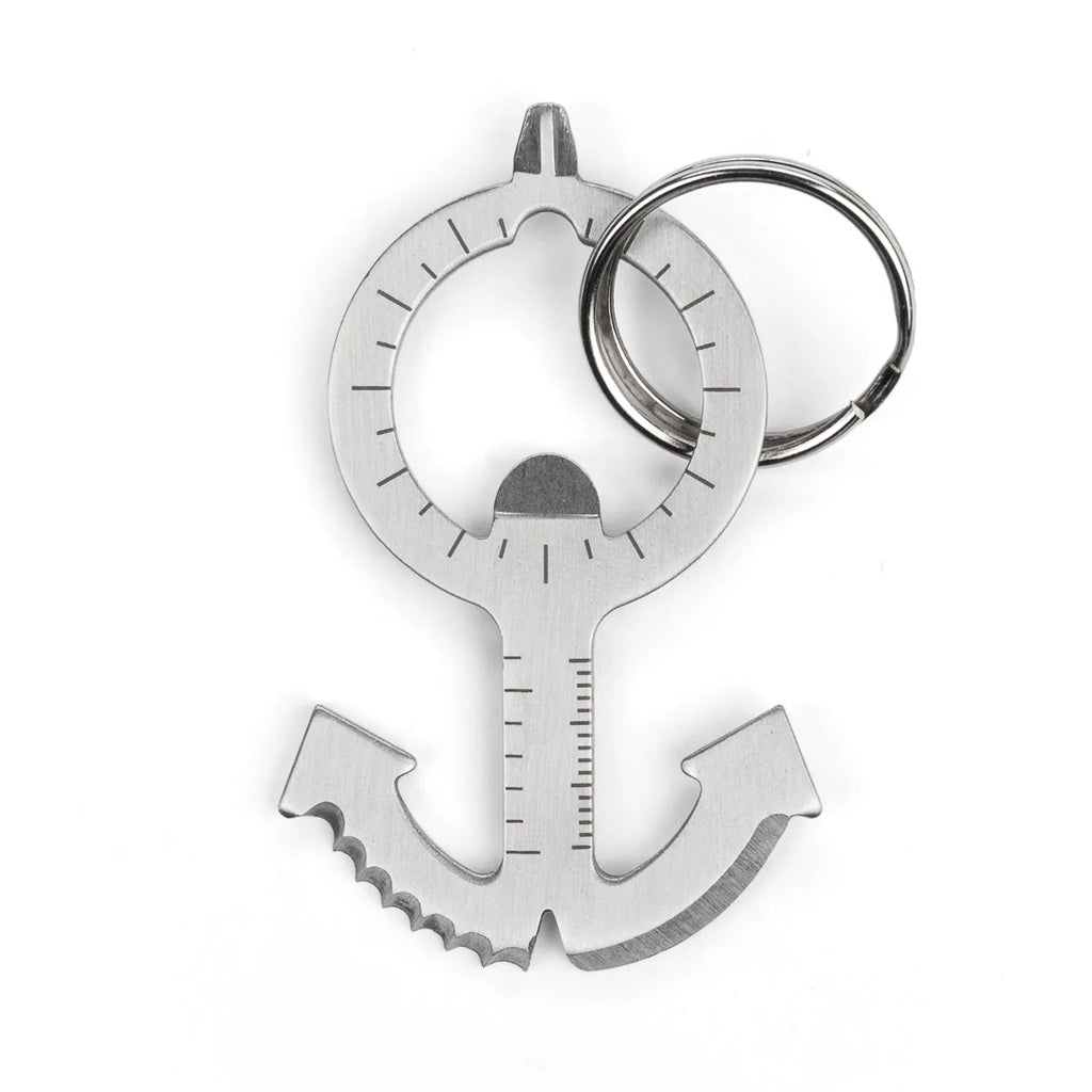 Silver anchor-shaped keychain tool with bottle opener and serrated edge.