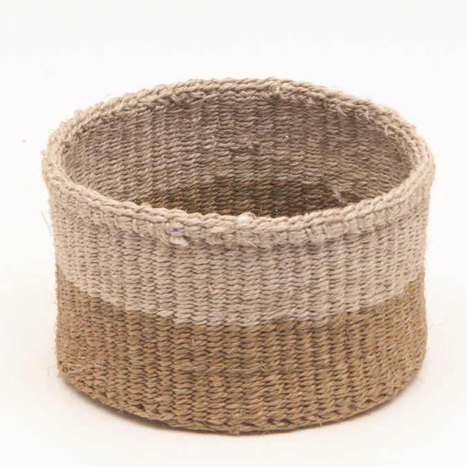 Cylindrical woven basket with a two-toned design; light beige top and darker tan bottom.