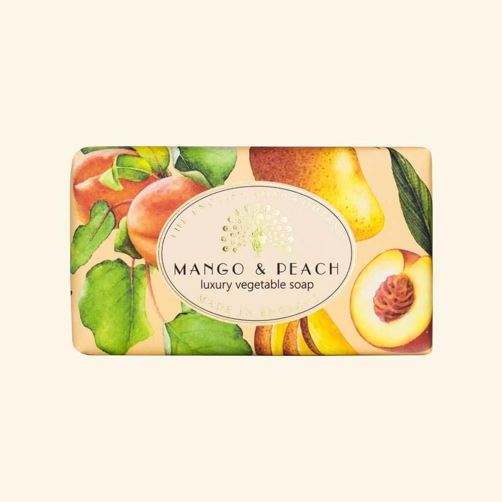 Mango & Peach luxury vegetable soap bar, illustrated with watercolor-style peaches and mangoes on a pale orange background.