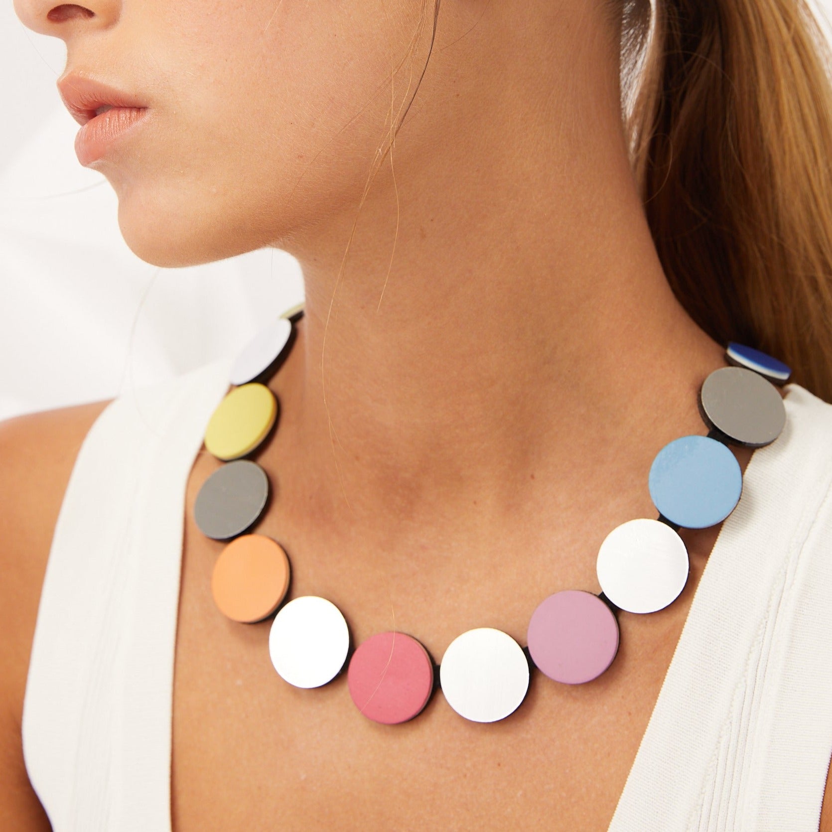 Pastel-colored round disc necklace.
