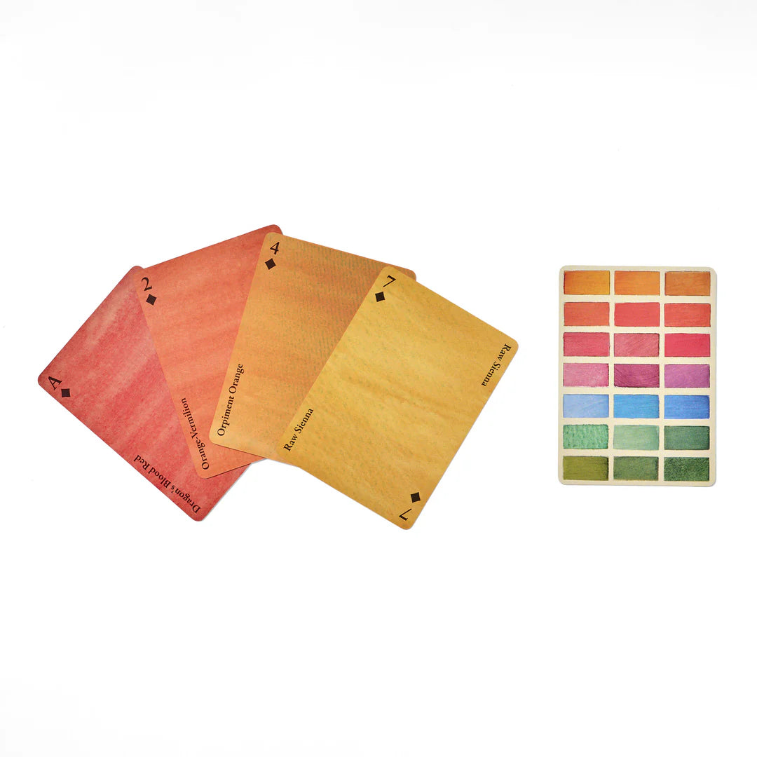 Four playing cards with color swatches on a white background