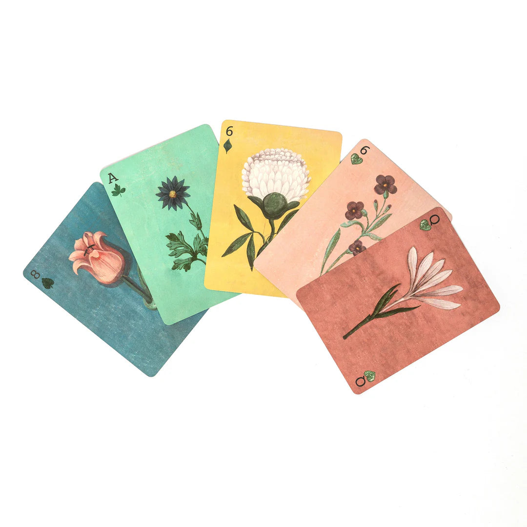 Set of playing cards with floral designs on a white background