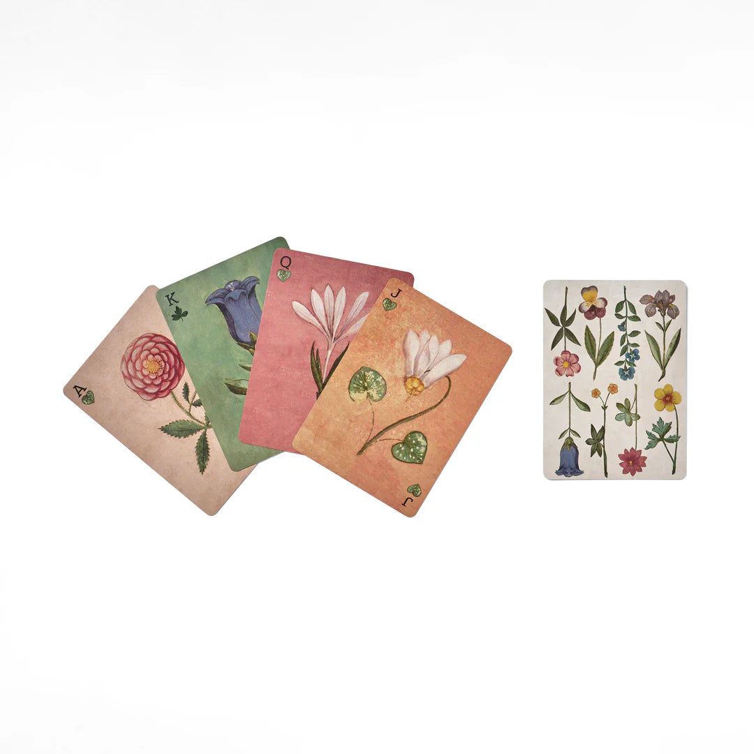 Set of playing cards with floral designs on a white background