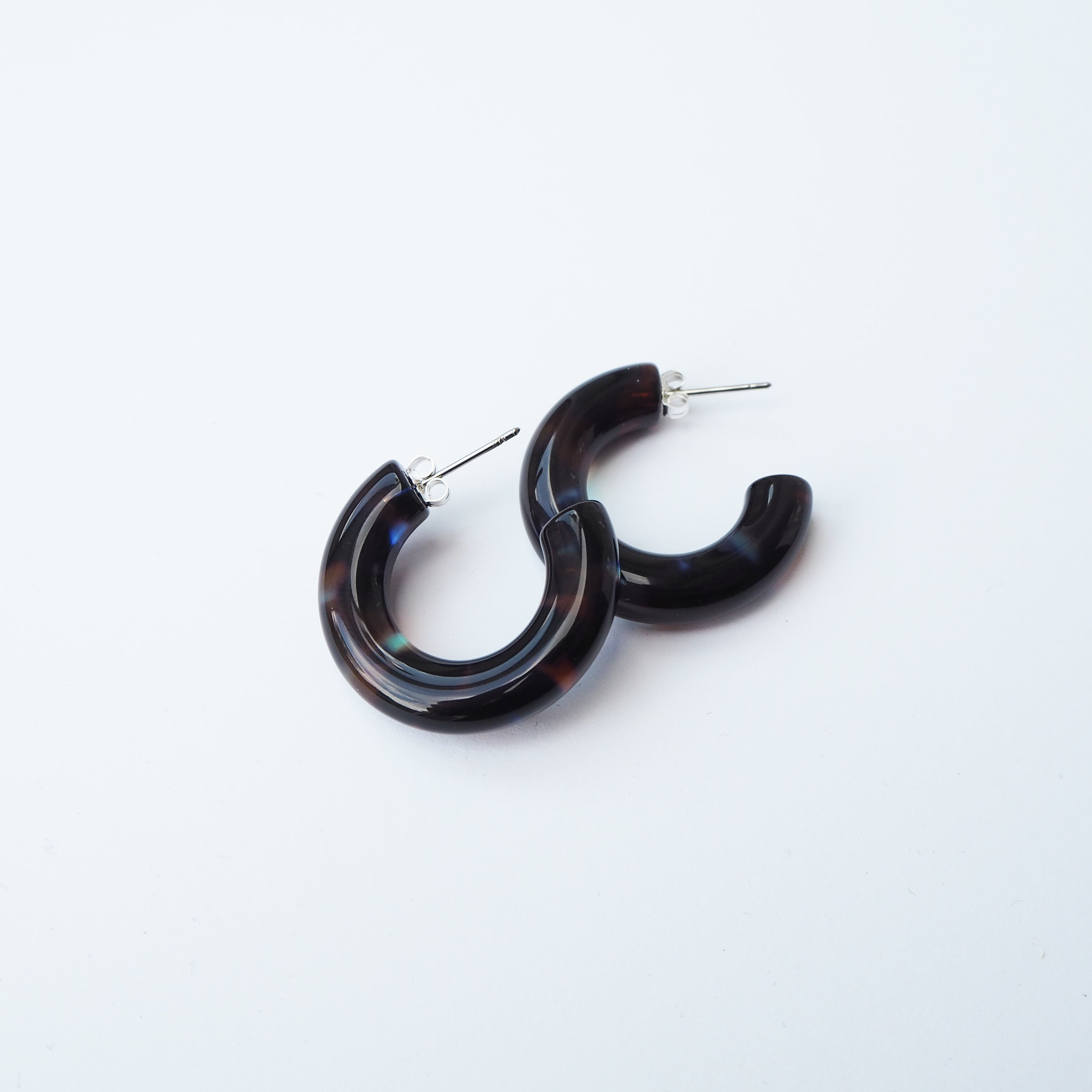 Pair of dark brown hoop earrings with subtle iridescent highlights.  Silver posts.