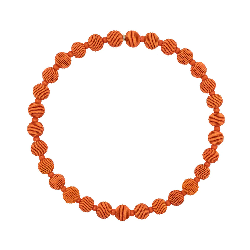 Orange beaded necklace forming a circle, each bead textured with horizontal lines.