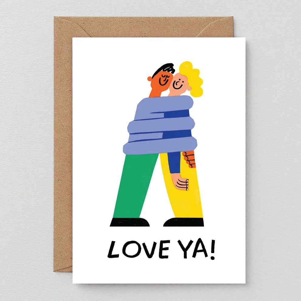 Greeting card with two people hugging and 'LOVE YA!' text, on a white background with a brown envelope.